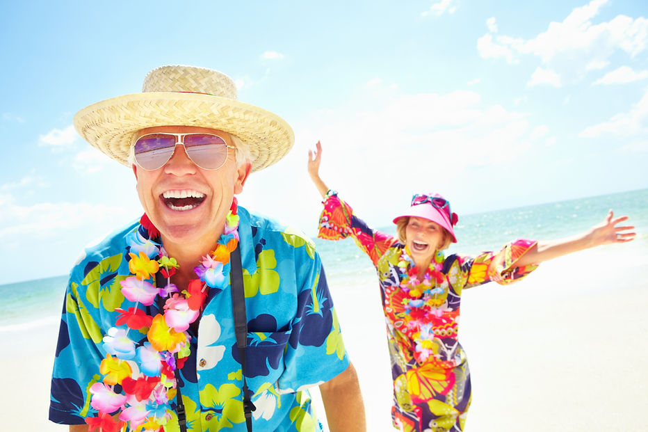 Smiling older man in front with woman in the background