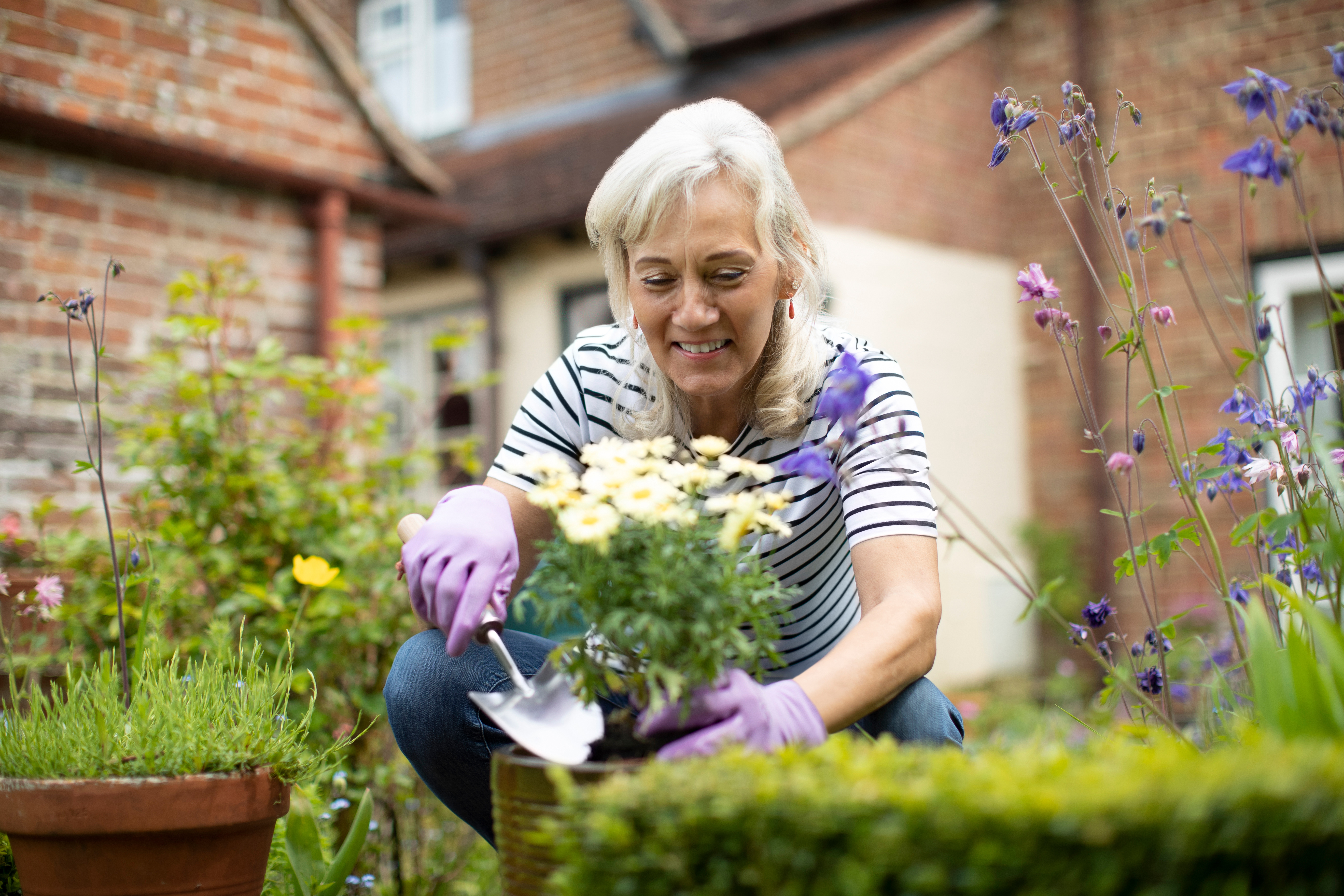 Woman tending to some flowers