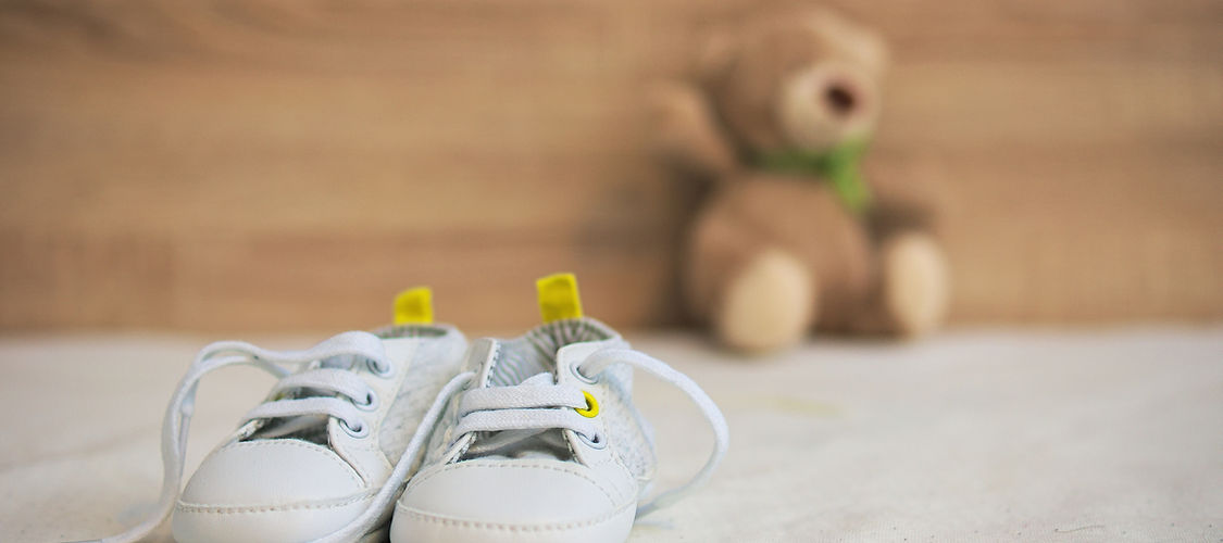 Shoes and bears waiting for a baby in fertility treatments