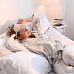 Woman Relaxing in Bed