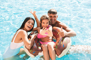 Family enjoying inground pool