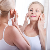 Woman grooming her face