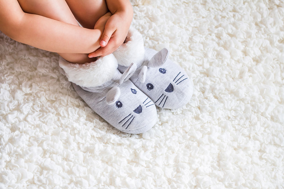 Child's feet in slippers.Child. Child's feet in slippers