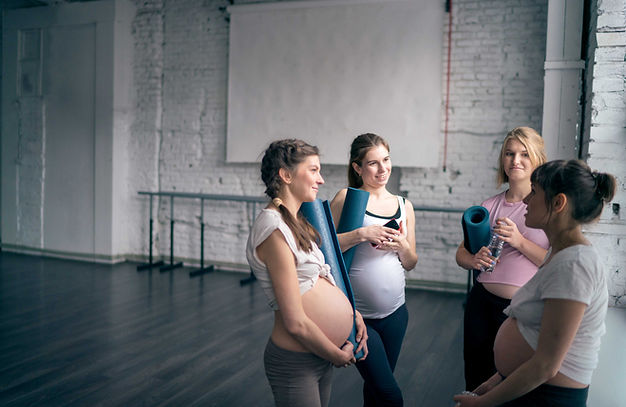 Pregnant women in yoga class