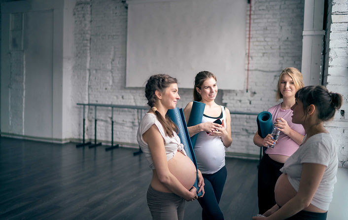 Pregnant women in yoga class