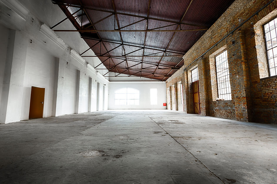 an old abandoned empty warehouse interior
