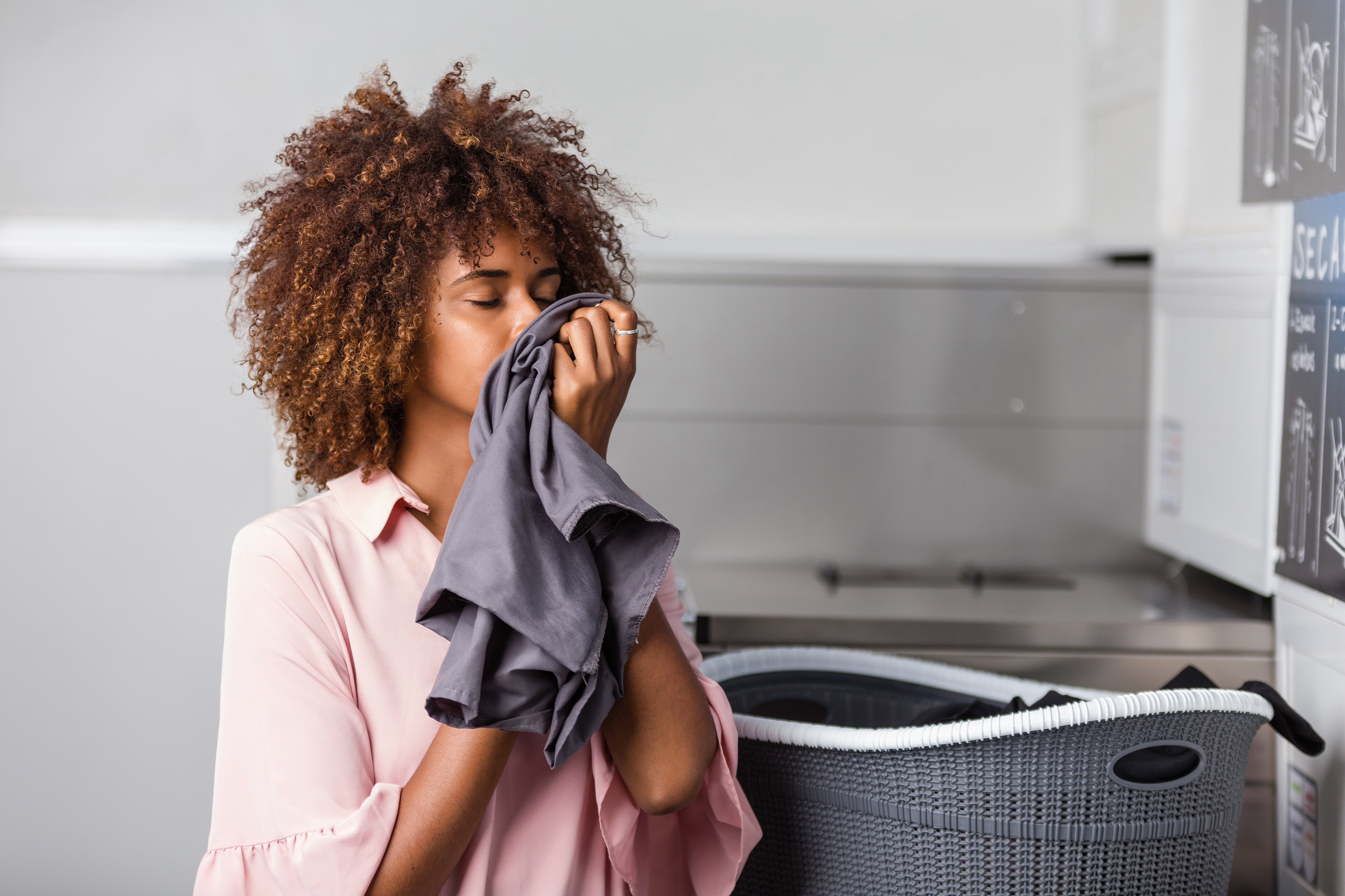 A women sniffing clothing