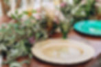 A table scape showing off chargers and goblets.