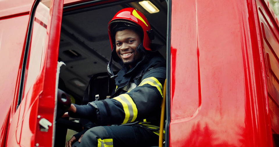 Smiling Firefighter in Truck