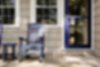 blue door and rocking chairs