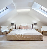 Bright attic bedroom in the apartment