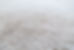 Close-up of a white shaggy carpet, shallow depth of field
