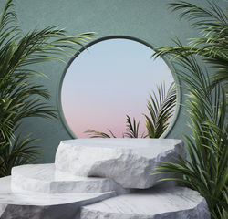 Stone slabs and palm leaves in front of a mirror 
