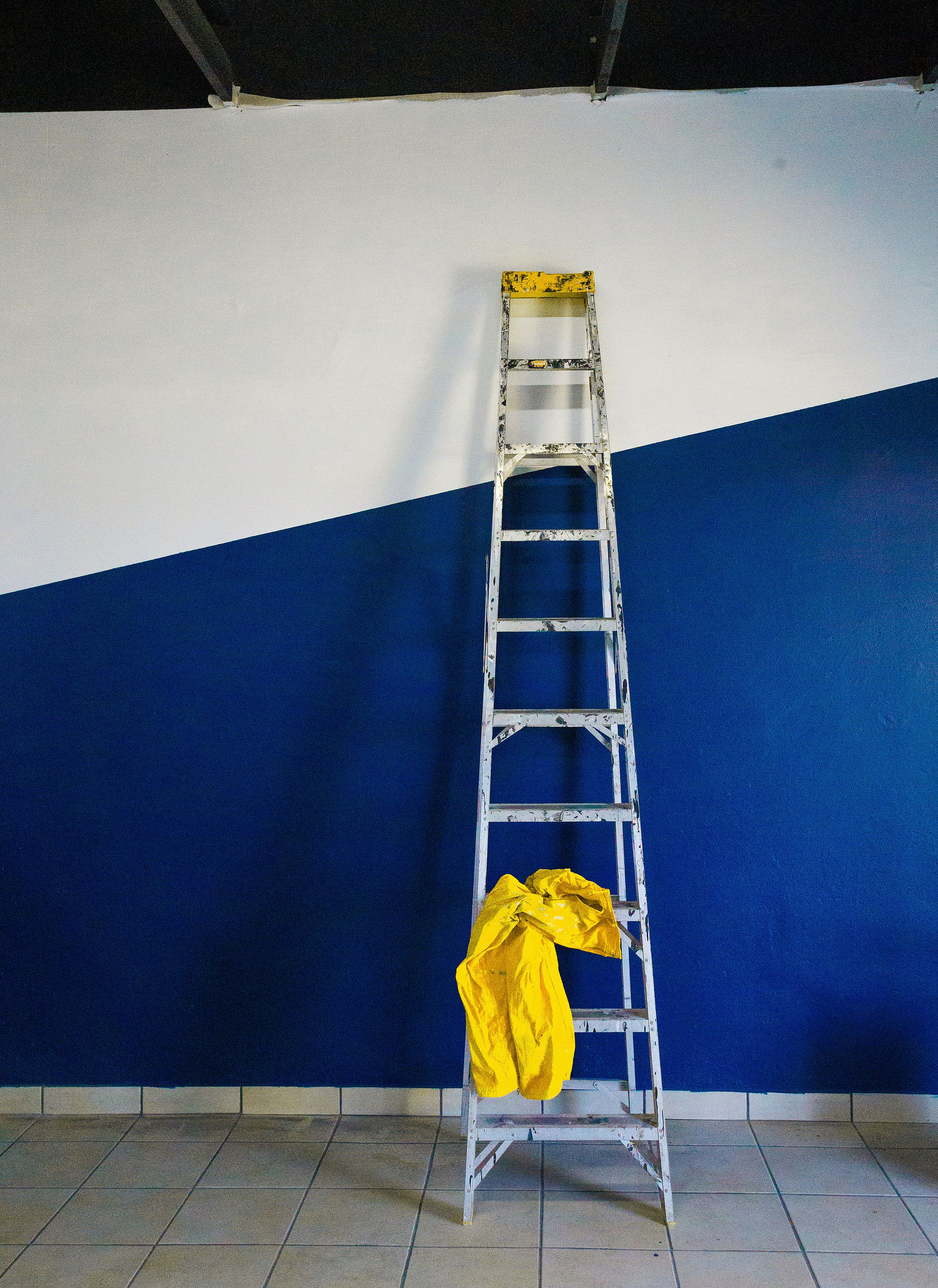 a leaning ladder against a wall