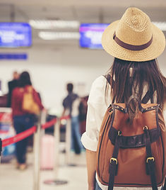 Asian female tourist waiting in line at an airport