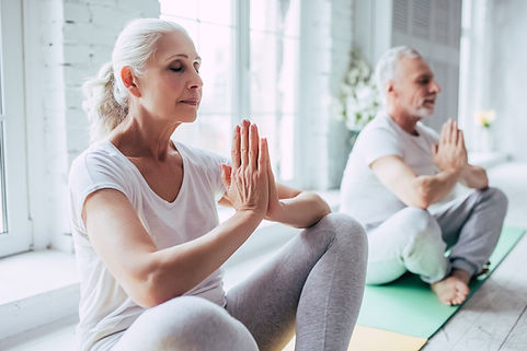 Senior Couple Doing Yoga