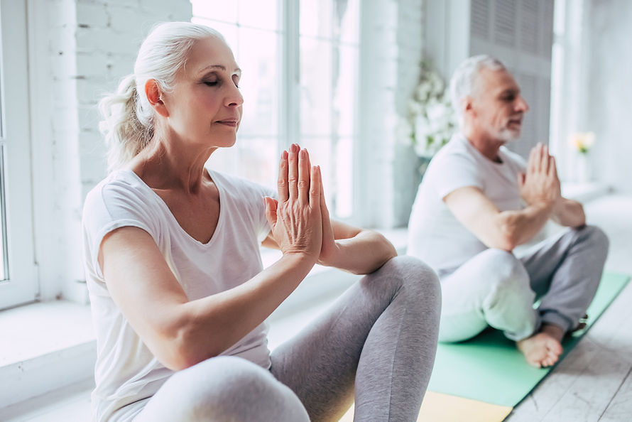 Senior Couple Doing Yoga