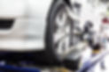 Closed up of an auto wheel that is undergoing wheel alignment