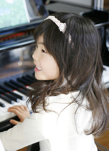 Child Playing the Piano