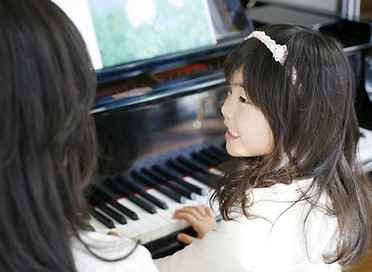 Child Playing the Piano
