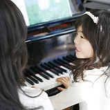 Child Playing the Piano
