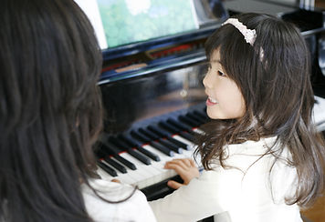Child Playing the Piano