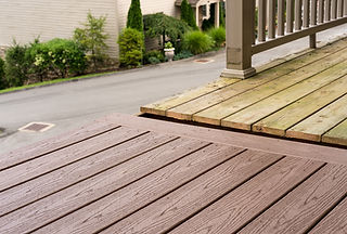Newly installed wooden timber decking panels for a garden patio