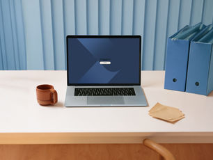A laptop shows a "Start" screen on a white desk with a brown mug, blue folders, and paper against a blue curtain backdrop. Calm setting.
