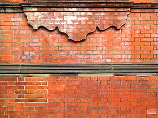 Detail of brick facade with decorative elements (cut bricks) of a building in central Lond