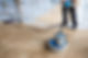 Professional marble floor polishing in progress using industrial equipment