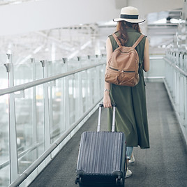 Traveler Walking In Airport