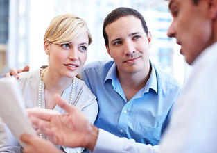 A couple discussing their housing needs with an expert