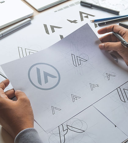 designer looking at logos