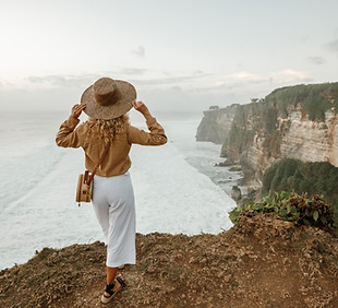 Woman standing on cliff's edge