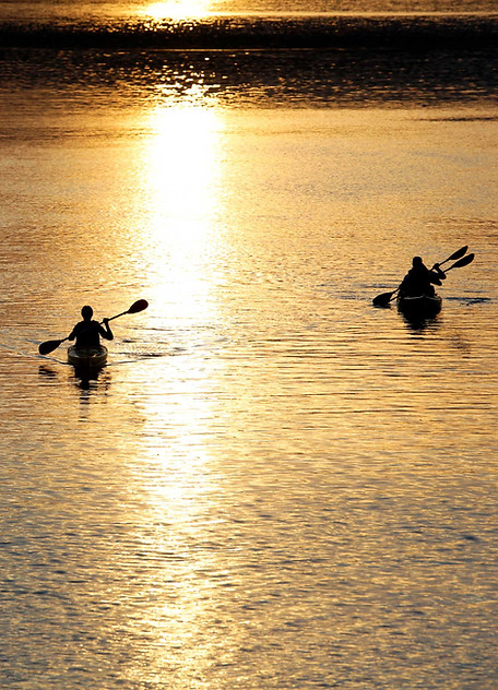 Kayakers At Sunset