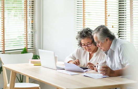 Couple calculating budget while being guided by virtual financial counselor