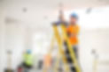electrician installing downlights