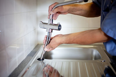 plumber fixing tap