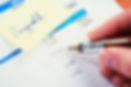 Man checking payroll data on paper