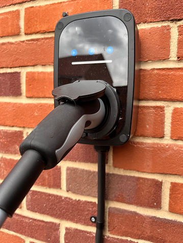 An electric vehicle charger plugged