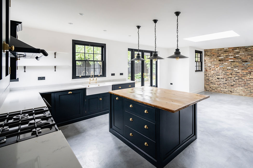 Spacious domestic kitchen area with granite countertops, kitchen island, pendant lighting,