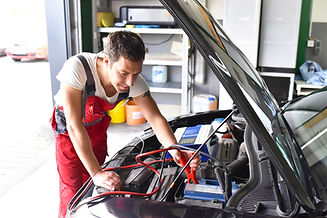 Mechanic checking car for faults