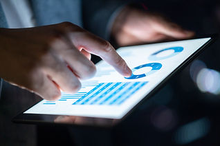 man using digital tablet for competitor analysis
