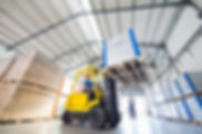 a person supervising forklift truck driver
