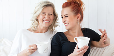 Women Laughing on Couch