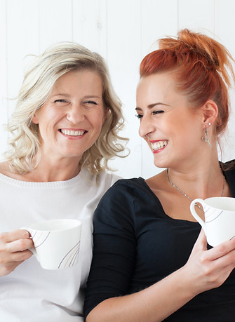 Women Laughing on Couch