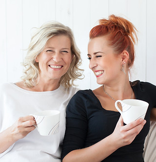 Women Laughing on Couch