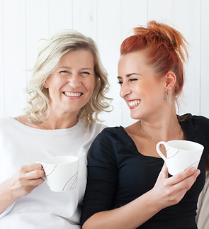 Women Laughing on Couch