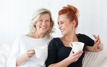 Women Laughing on Couch