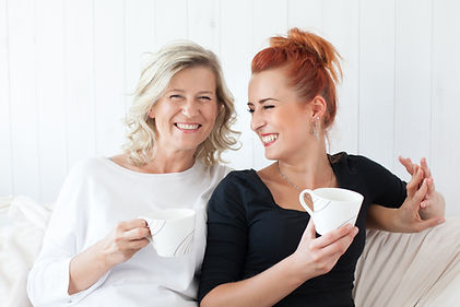 Women Laughing on Couch